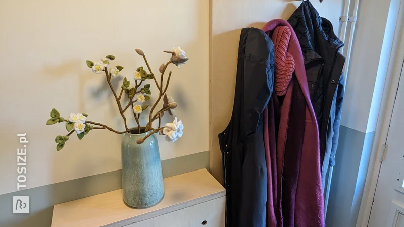 Pegboard coat rack and shoe cabinet, by Linda