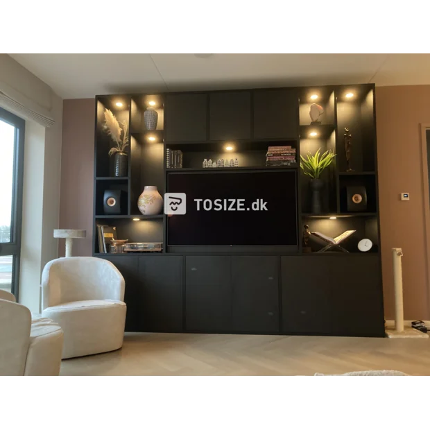 Black cupboard wall with doors and open compartments