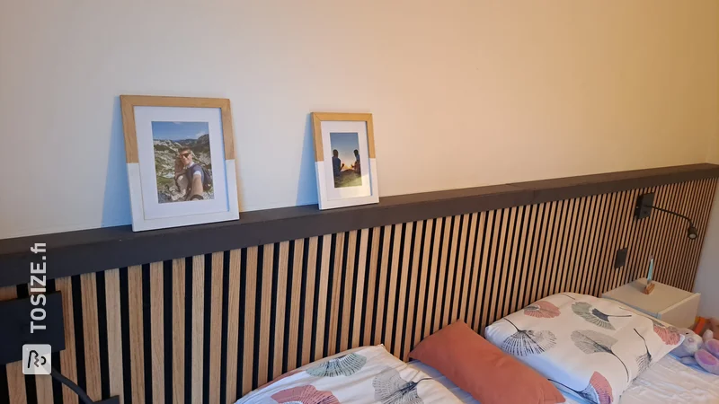 A narrow custom-made window sill made of black MDF, by Thomas