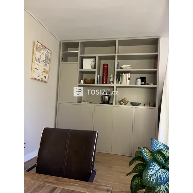 Gray cupboard wall with open compartments and doors