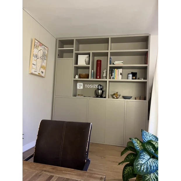 Gray cupboard wall with open compartments and doors