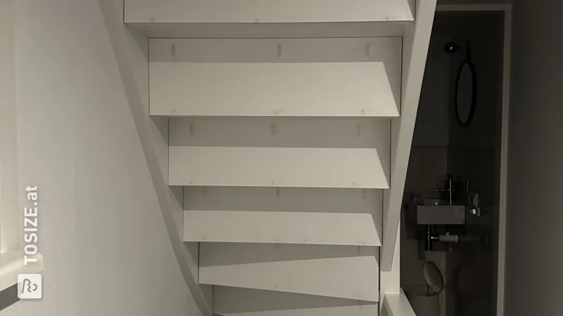 Close an open staircase yourself with custom plywood panels, by Iris 