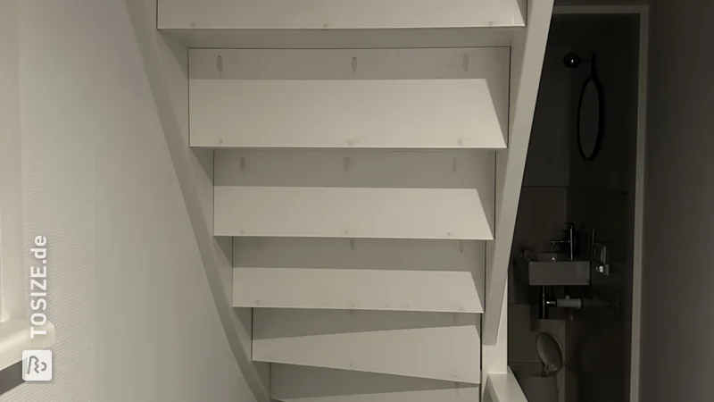 Close an open staircase yourself with custom plywood panels, by Iris 