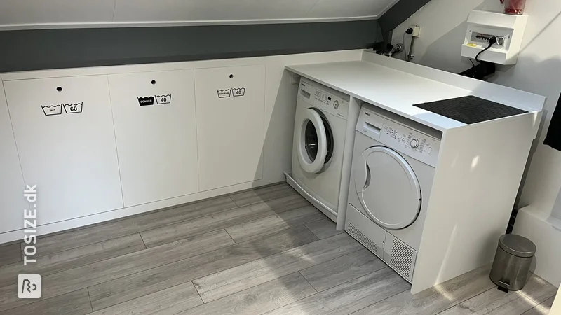 DIY Laundry and storage space sloping wall in the attic, by Edwin