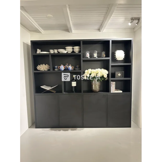 Black cupboard wall with open compartments and doors