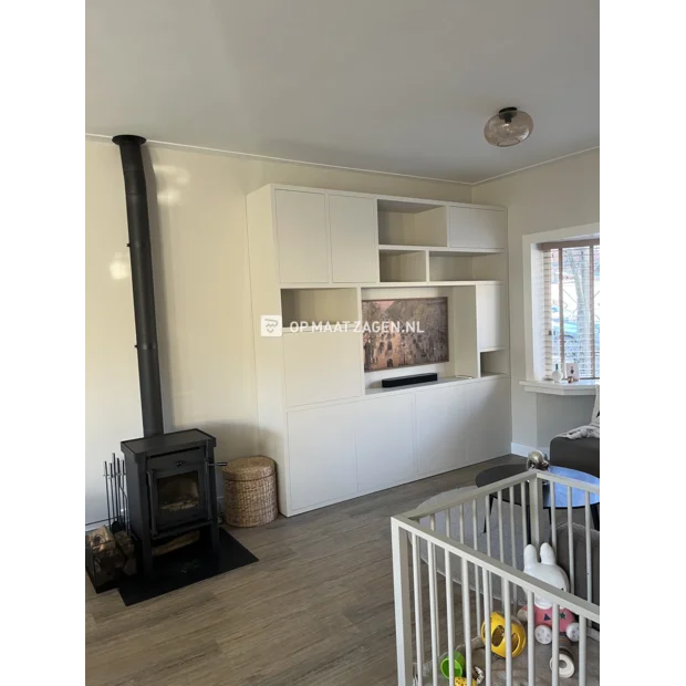 White cupboard wall with open compartments and doors