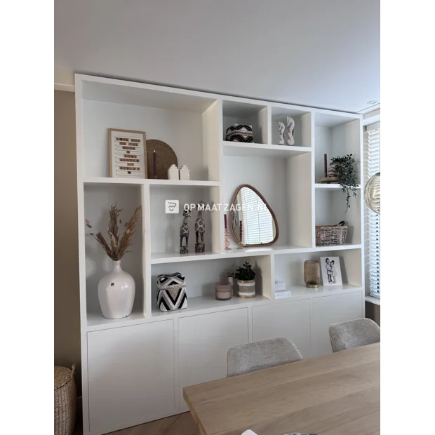 White cupboard wall with open compartments and doors