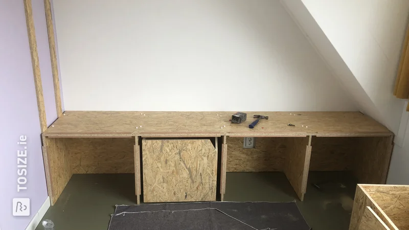 A custom-made large attic cupboard made of OSB, by Maurits