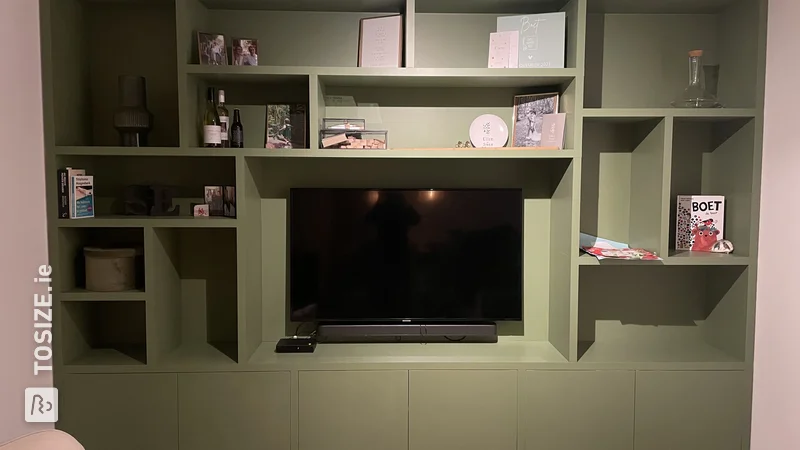 Custom wall cabinet with space for TV, by Ellen