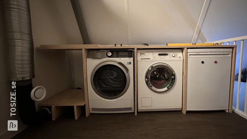 A homemade laundry room with custom plywood, by Helma