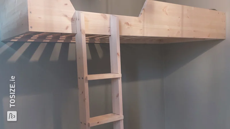 A homemade loft bed made of custom pine carpentry panel, by Bert
