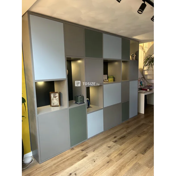 Gray cupboard wall with open compartments and doors