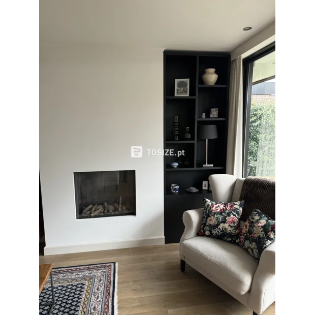 Black cupboard wall with open compartments and doors