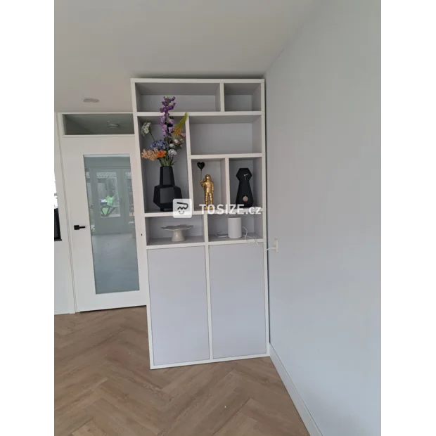 White shelving unit with open compartments and doors