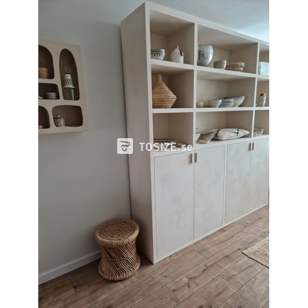 Cream cabinet with doors and open compartments