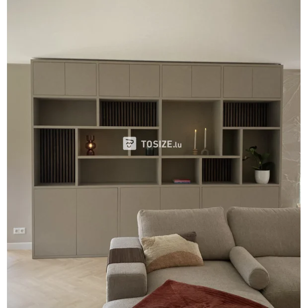 Beige cupboard wall with open compartments and doors