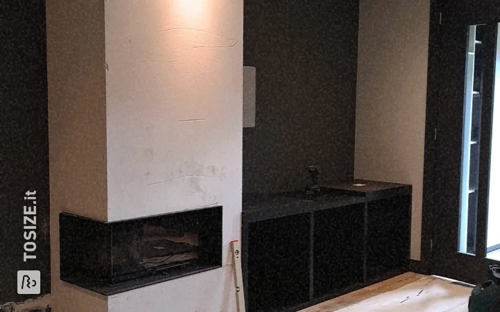 Eleganti mobili neri con stufa per il soggiorno, di Leanne