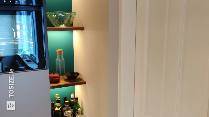 Shelves with LED lighting in the kitchen niche