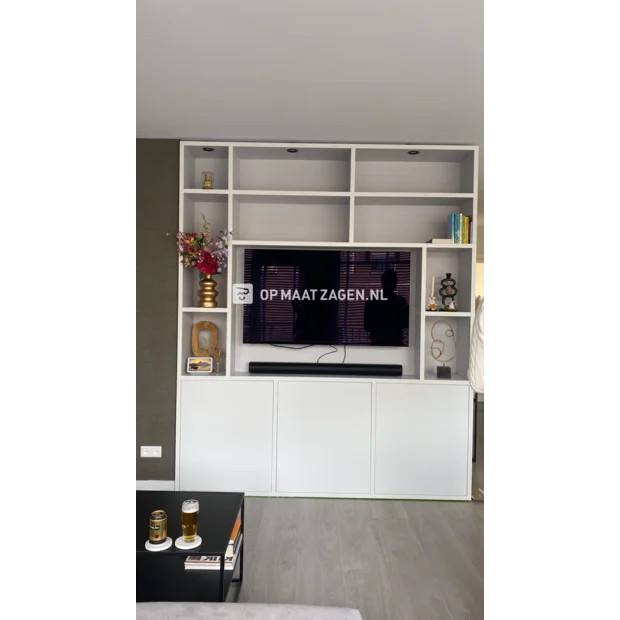 White cupboard wall with open compartments and doors