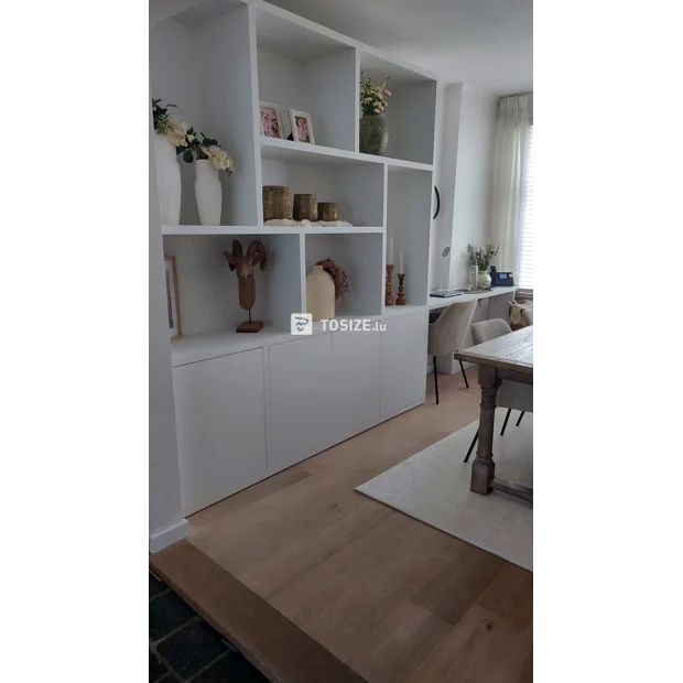 White cupboard wall with open compartments and doors