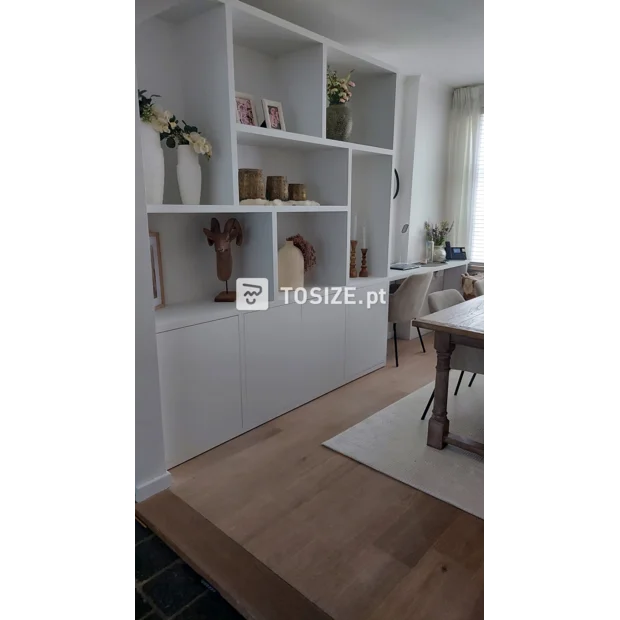 White cupboard wall with open compartments and doors