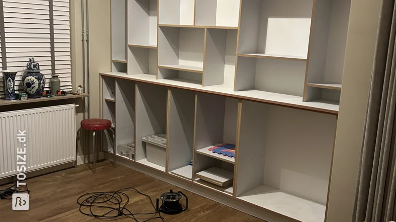 Create a shelving unit in the alcove of your living room, by Ricky