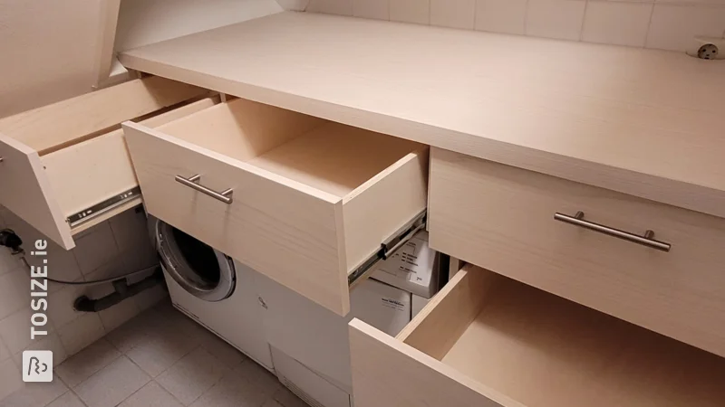 A self-made laundry room with lots of storage space, by Paul