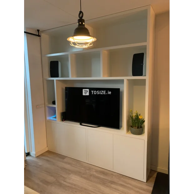 White cupboard wall with open compartments and doors