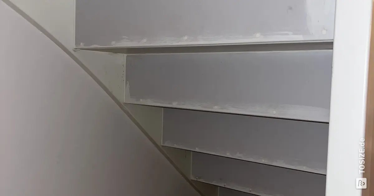 Close an open staircase yourself with custom-sawn MDF and primed ...