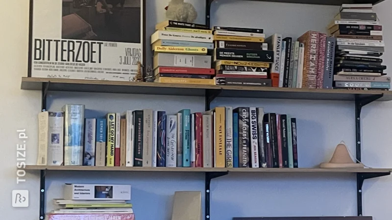 Homemade dark brown concrete plywood bookshelf, by Marie