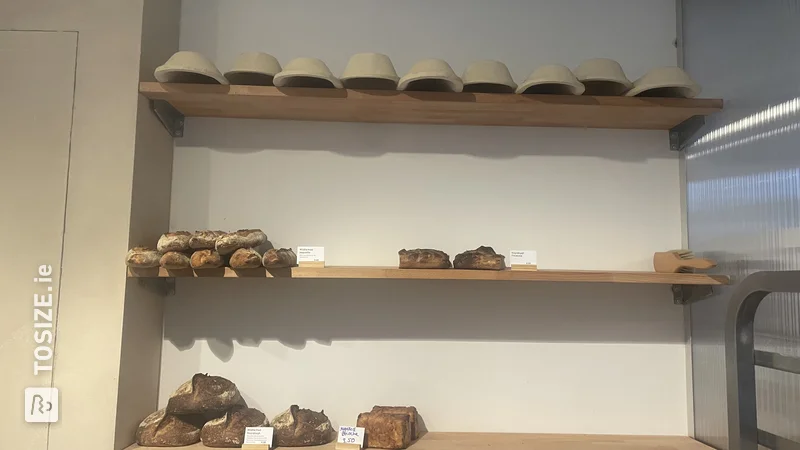 DIY shelves for breads in bakery shop, by Loes