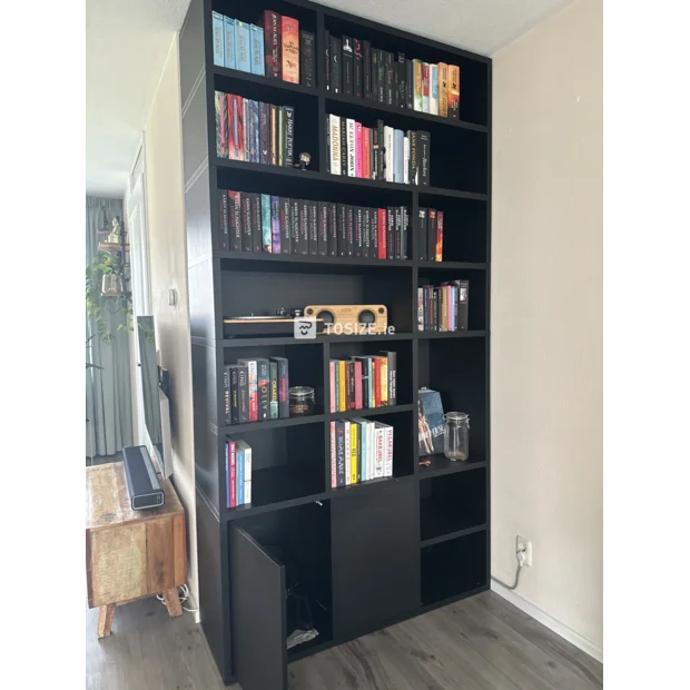 Black bookcase with open shelves and doors