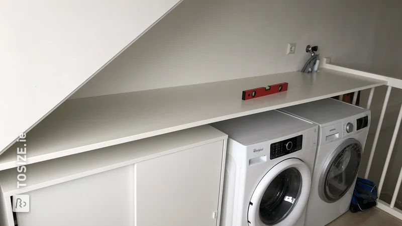Efficient work shelf above the washing machine/dryer, by Ramon