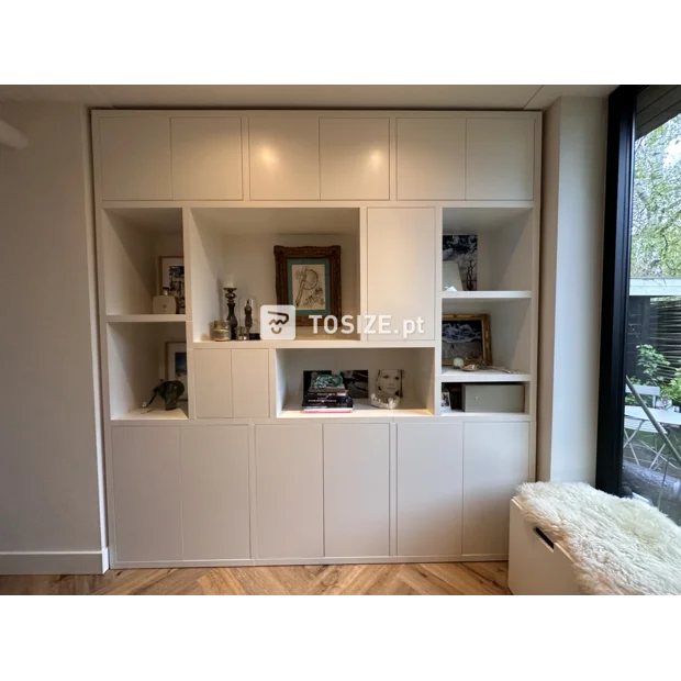 White cupboard wall with doors and open compartments