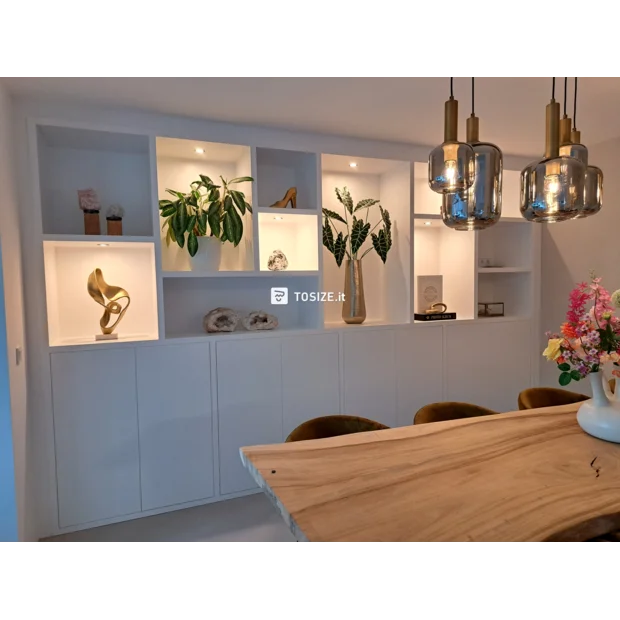 White cupboard wall with doors and open compartments