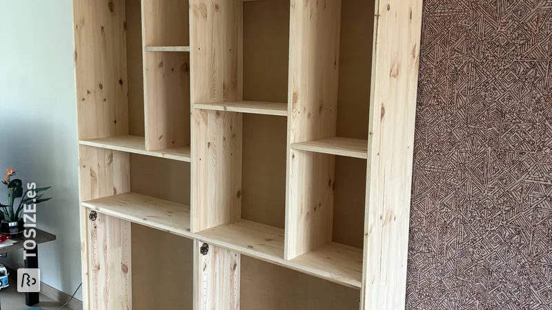 Create a custom shelving unit for your living room, by Rianne