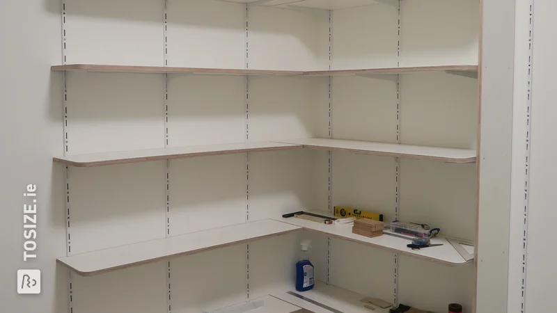 Custom-made storage shelves in new apartment, by Anton