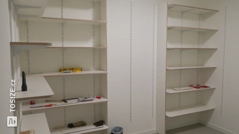 Custom-made storage shelves in new apartment, by Anton