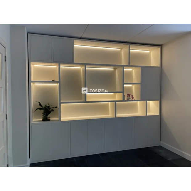 White cupboard wall with open compartments and doors