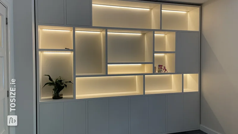 Custom cabinet wall with LED lighting, by Xander