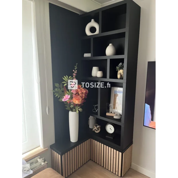 Black cupboard wall with open compartments and shelves