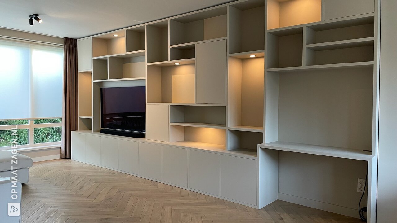 Custom wall-filling media furniture with desk by Hugo