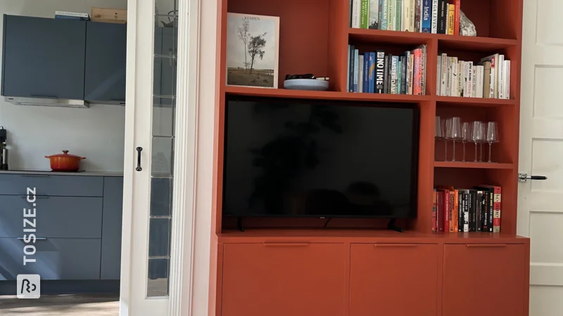 Bookcase in a beautiful terracotta color, by Daan