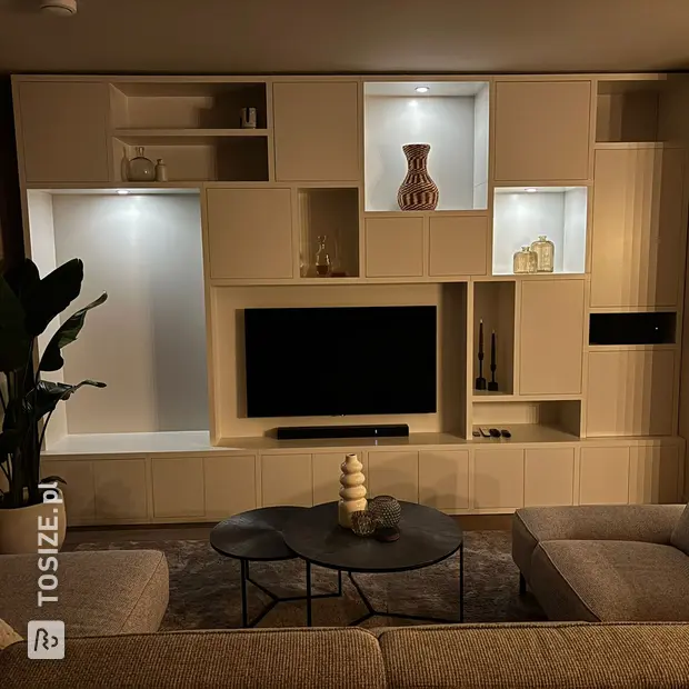White cupboard wall with open compartments and doors