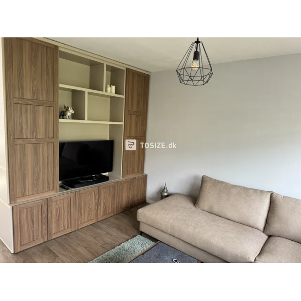 Beige cupboard wall with doors and open compartments