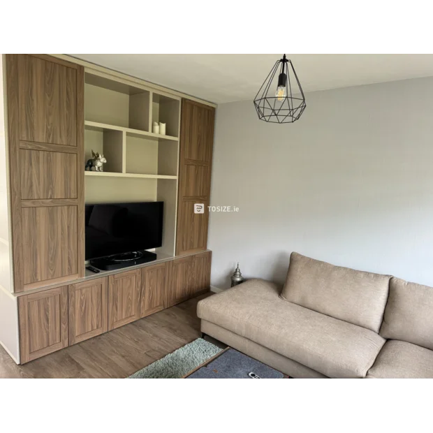 Beige cupboard wall with doors and open compartments