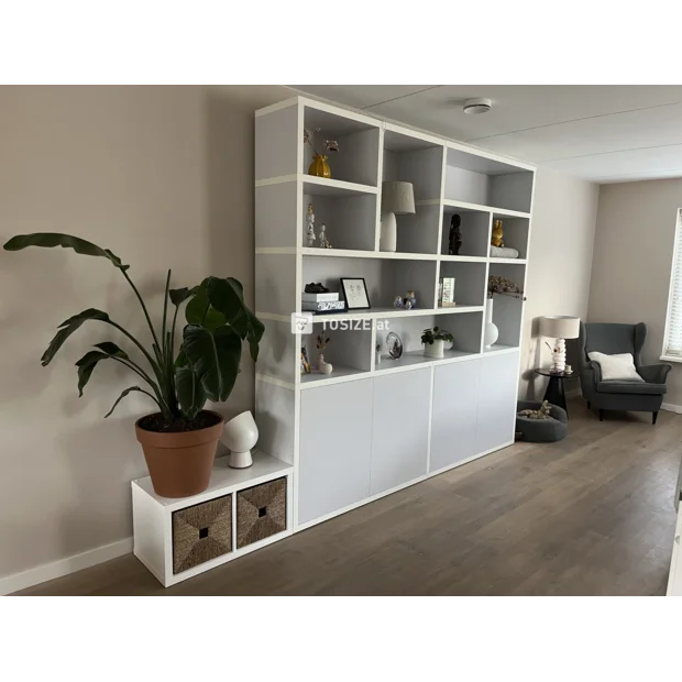 Gray cupboard wall with open compartments and doors