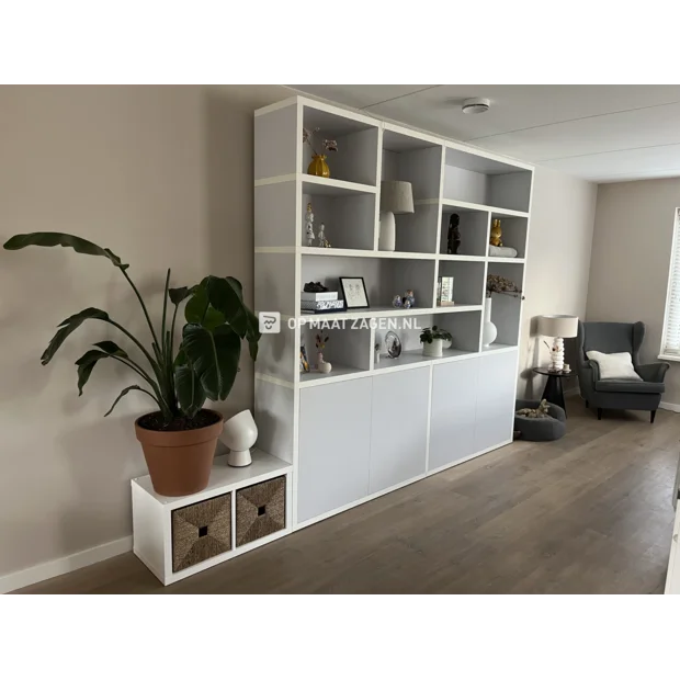 Gray cupboard wall with open compartments and doors