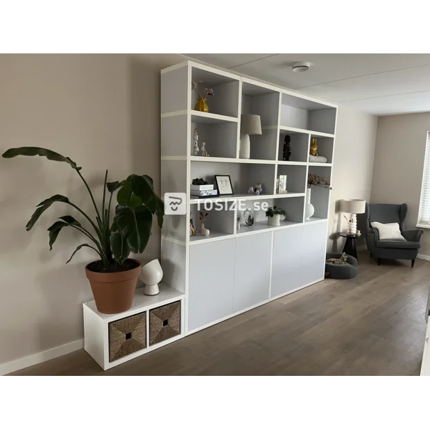 Gray cupboard wall with open compartments and doors