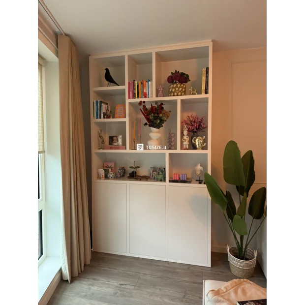 White cupboard wall with open compartments and doors